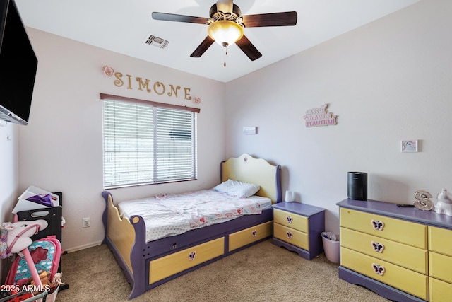 bedroom with light colored carpet, visible vents, and ceiling fan