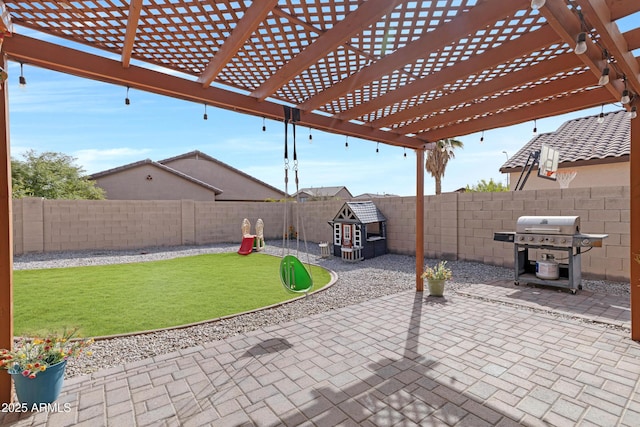 view of patio featuring grilling area, a fenced backyard, and a pergola