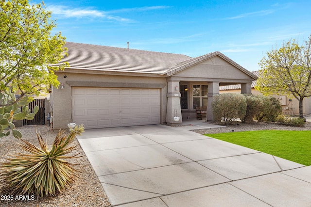 ranch-style home with stucco siding, concrete driveway, fence, a garage, and a tiled roof