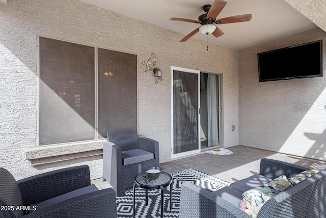 view of patio featuring ceiling fan