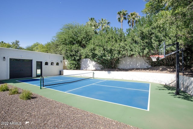 view of tennis court featuring fence