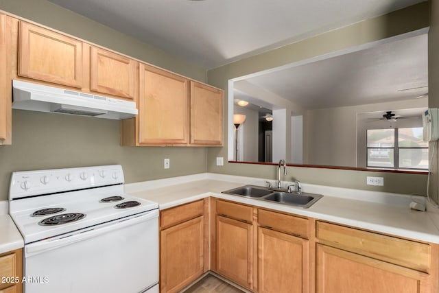 kitchen with light countertops, white electric range, under cabinet range hood, and a sink