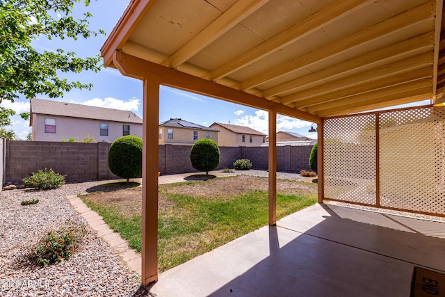 view of patio / terrace featuring a fenced backyard and a residential view