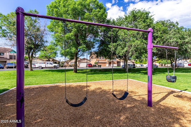 view of jungle gym featuring a lawn and a residential view