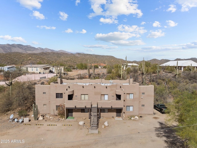 birds eye view of property with a mountain view