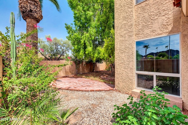 view of yard featuring a patio and fence