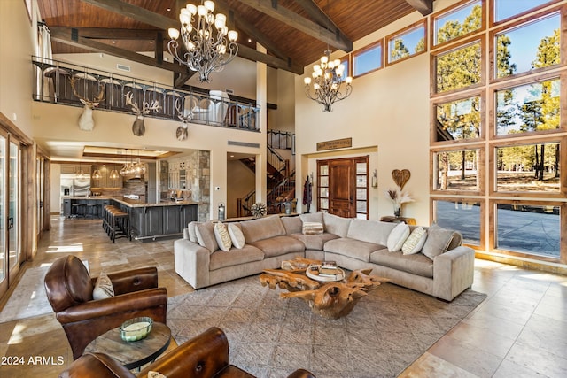 living room featuring beam ceiling, high vaulted ceiling, wooden ceiling, and an inviting chandelier