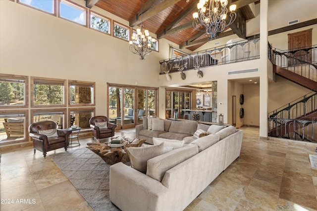 living room with beam ceiling, a chandelier, high vaulted ceiling, and wooden ceiling