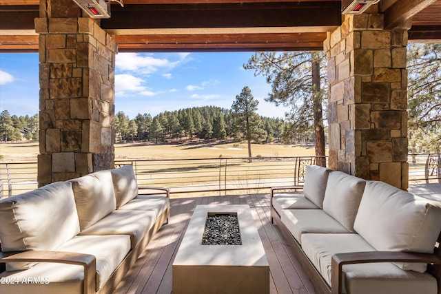 view of patio / terrace featuring an outdoor living space with a fire pit