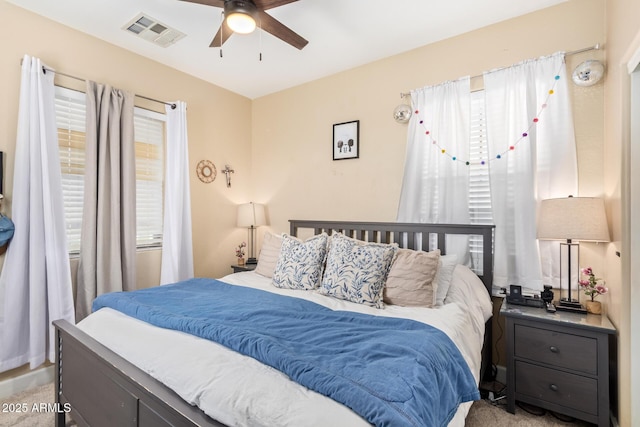 bedroom featuring visible vents and ceiling fan