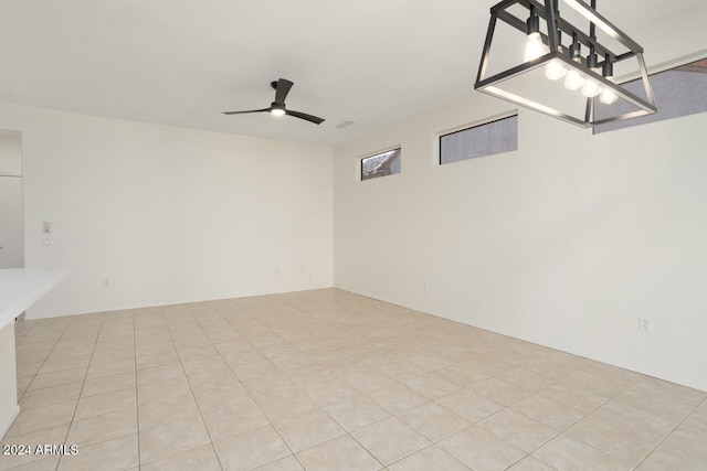 interior space with light tile patterned flooring and ceiling fan