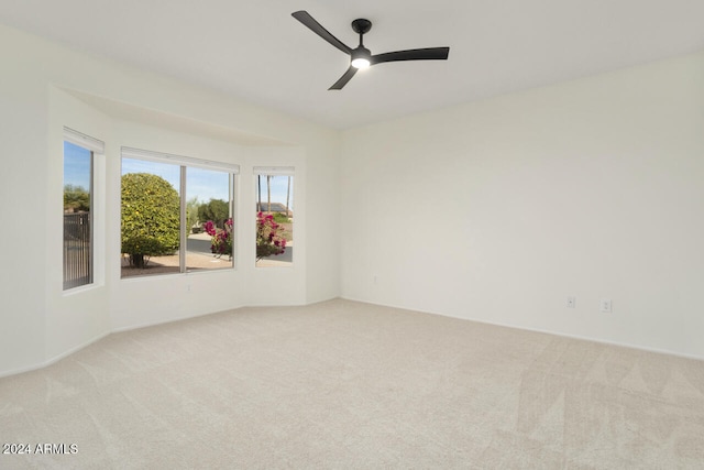 carpeted empty room with ceiling fan