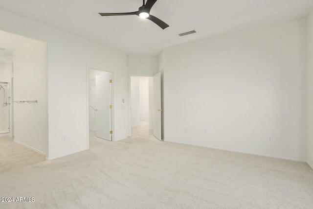 interior space with ceiling fan