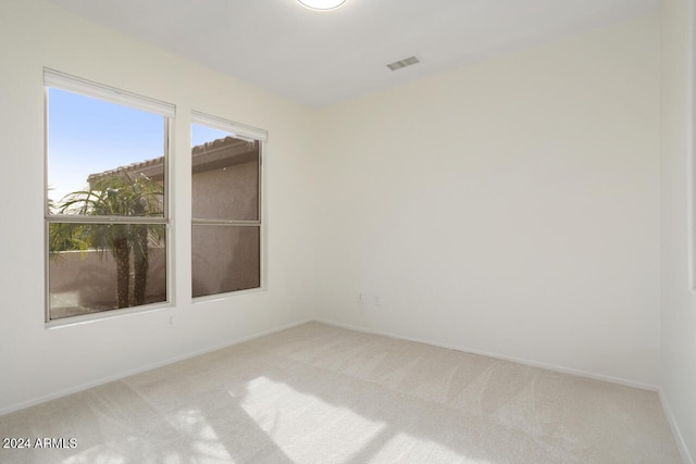 empty room featuring carpet flooring