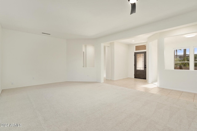 empty room featuring light colored carpet