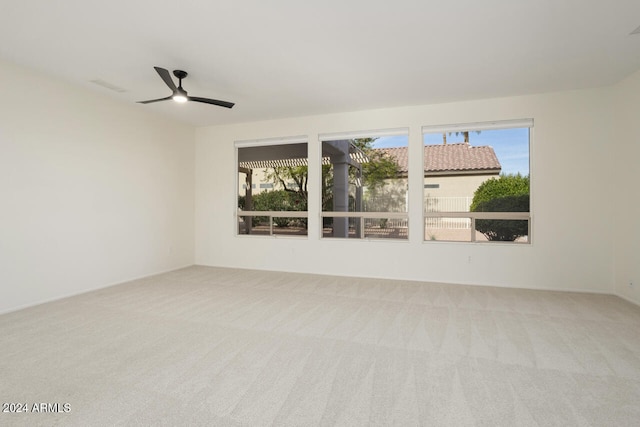 carpeted empty room with ceiling fan