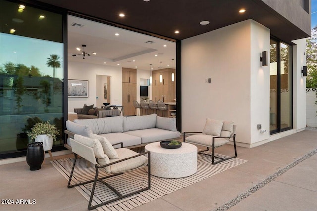 patio terrace at night with an outdoor living space