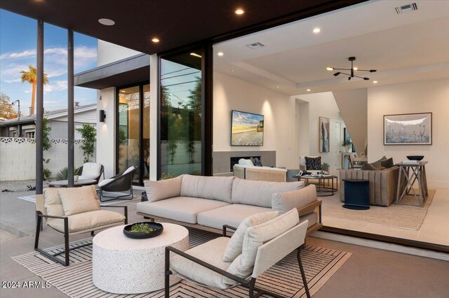 view of patio / terrace featuring an outdoor living space and ceiling fan