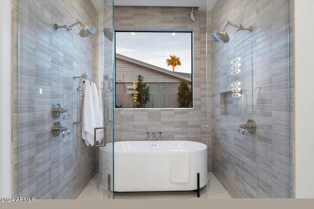 bathroom featuring separate shower and tub