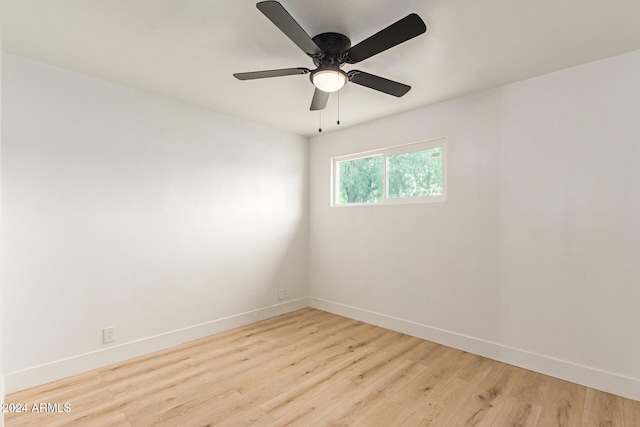 spare room featuring light wood-type flooring and ceiling fan