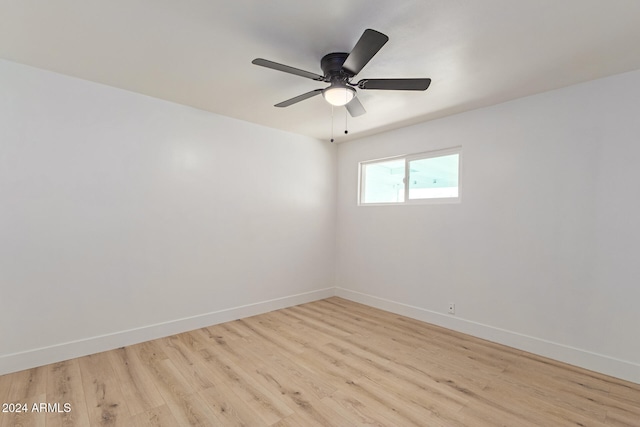 spare room with ceiling fan and light hardwood / wood-style floors