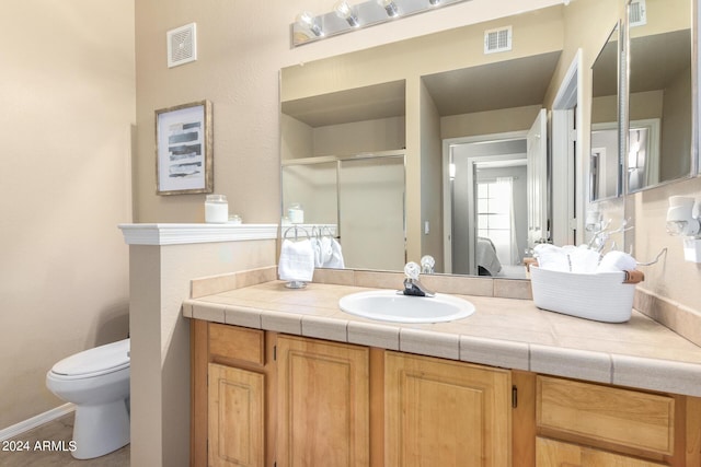 full bath featuring toilet, a stall shower, and visible vents