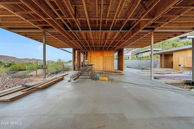 misc room with a mountain view and concrete floors