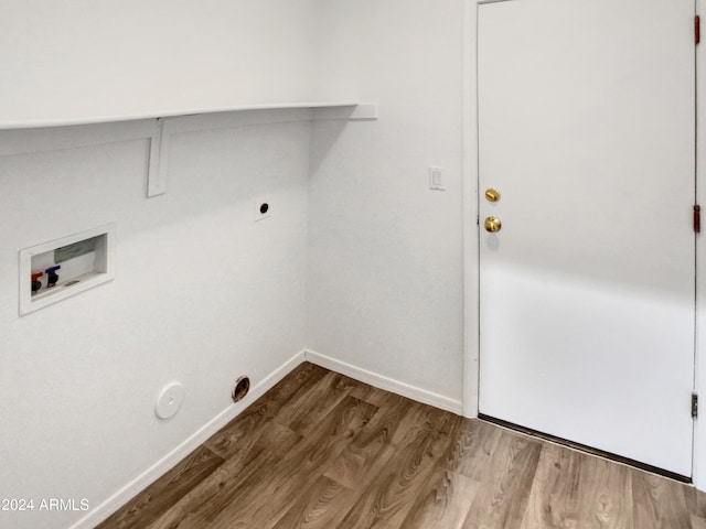 laundry room featuring baseboards, laundry area, hookup for a washing machine, hookup for a gas dryer, and wood finished floors