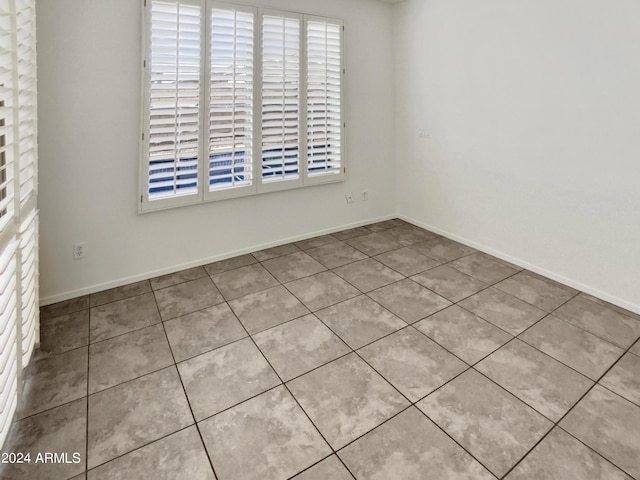 empty room with baseboards