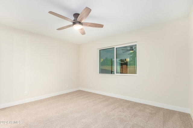 unfurnished room featuring ceiling fan and carpet floors