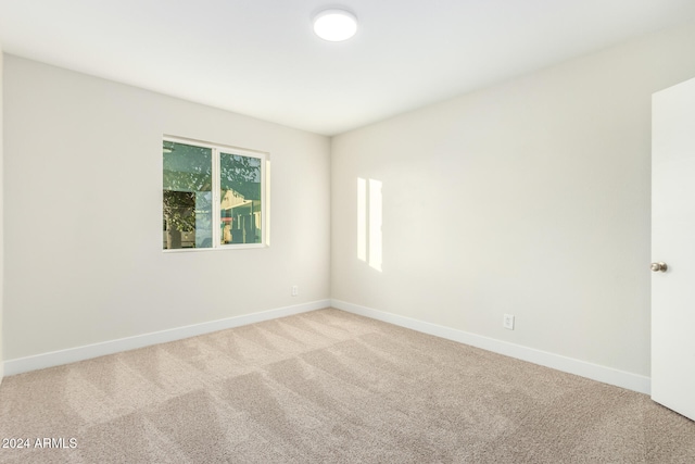 empty room with carpet flooring