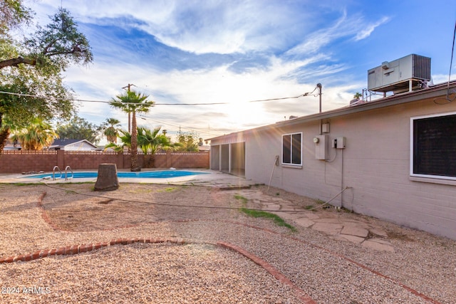 view of yard featuring a fenced in pool and a patio area