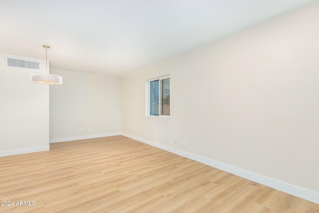 spare room featuring light wood-type flooring