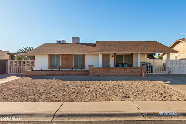 single story home featuring a carport