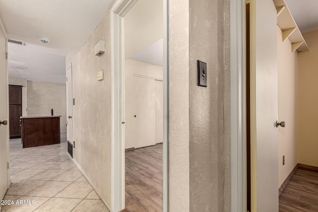 hallway featuring light hardwood / wood-style flooring