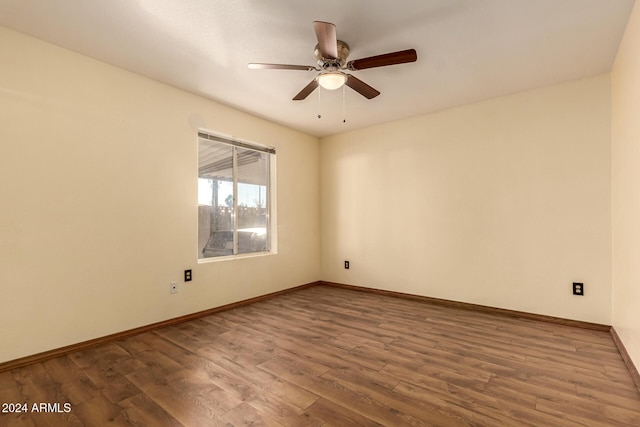 empty room featuring ceiling fan and hardwood / wood-style flooring