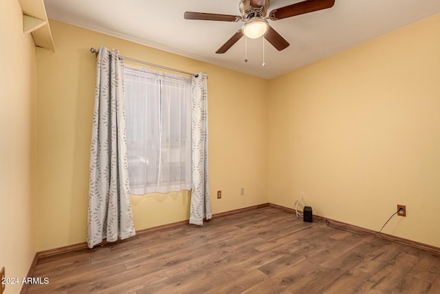 empty room featuring ceiling fan and wood-type flooring