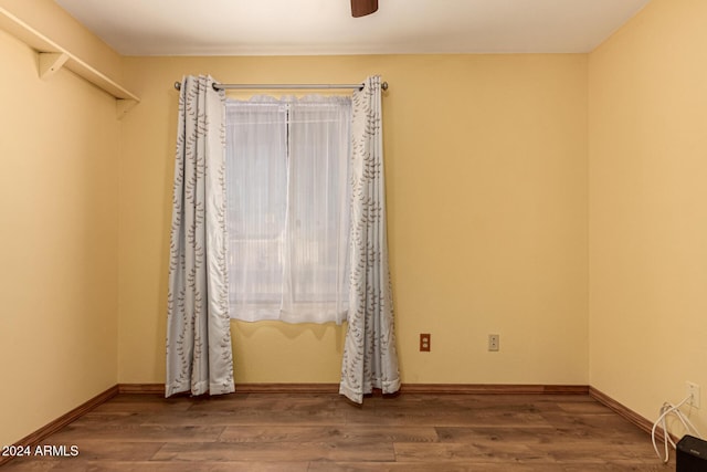 spare room featuring ceiling fan and hardwood / wood-style floors