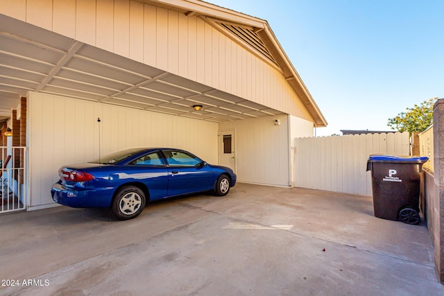 view of vehicle parking with a carport