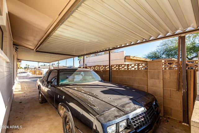 view of parking / parking lot with a carport