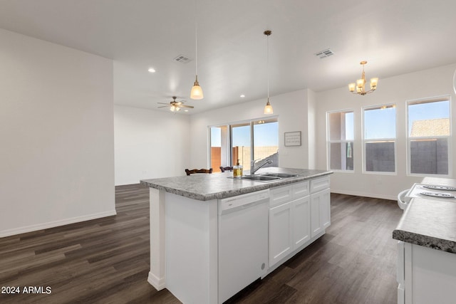 kitchen with a kitchen island with sink, pendant lighting, ceiling fan with notable chandelier, white appliances, and dark hardwood / wood-style flooring