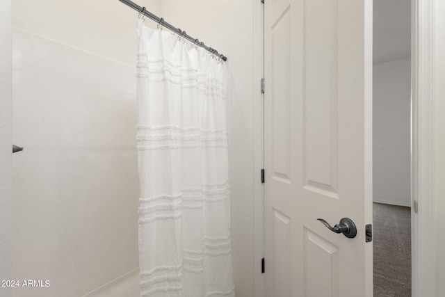 bathroom with curtained shower