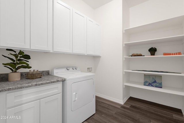 washroom featuring washer / clothes dryer, dark hardwood / wood-style floors, and cabinets