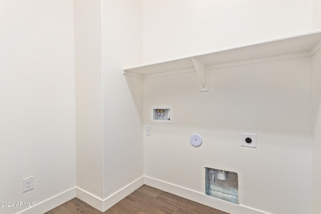 clothes washing area with hookup for an electric dryer, washer hookup, dark hardwood / wood-style floors, and gas dryer hookup