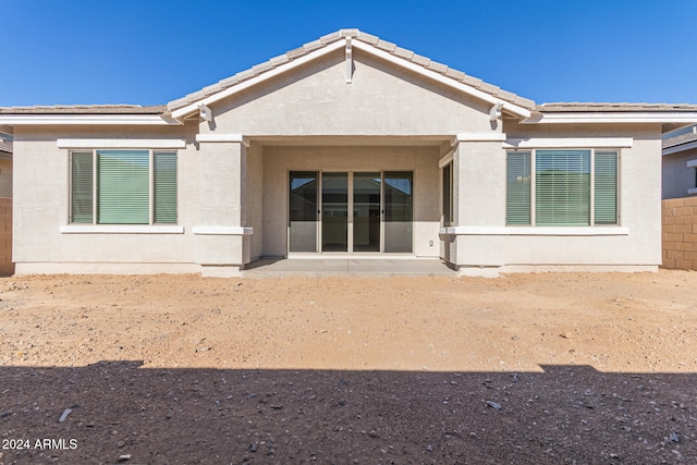 back of property featuring a patio area