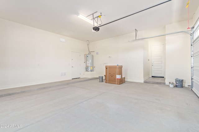 garage with a garage door opener and water heater