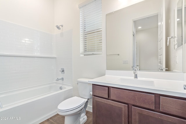 full bathroom featuring bathing tub / shower combination, toilet, vanity, and hardwood / wood-style flooring