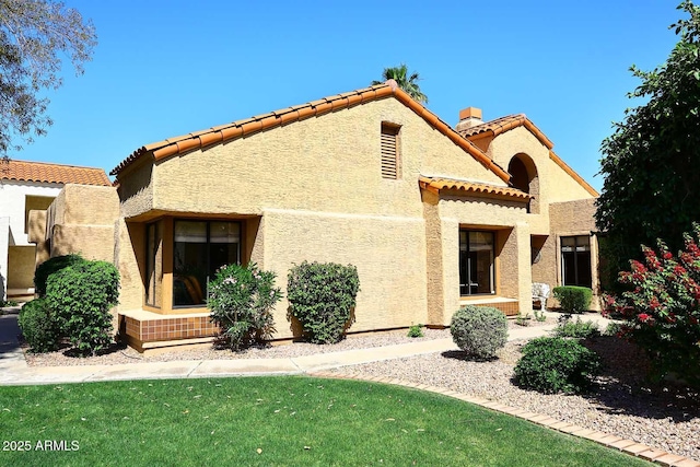 9115 N 101st Way, Scottsdale, AZ 85258 - rear view of property featuring stucco siding and a tile roof