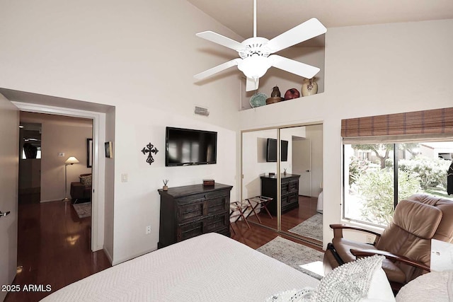 9115 N 101st Way, Scottsdale, AZ 85258 - bedroom featuring wood finished floors, high vaulted ceiling, a closet, and a ceiling fan