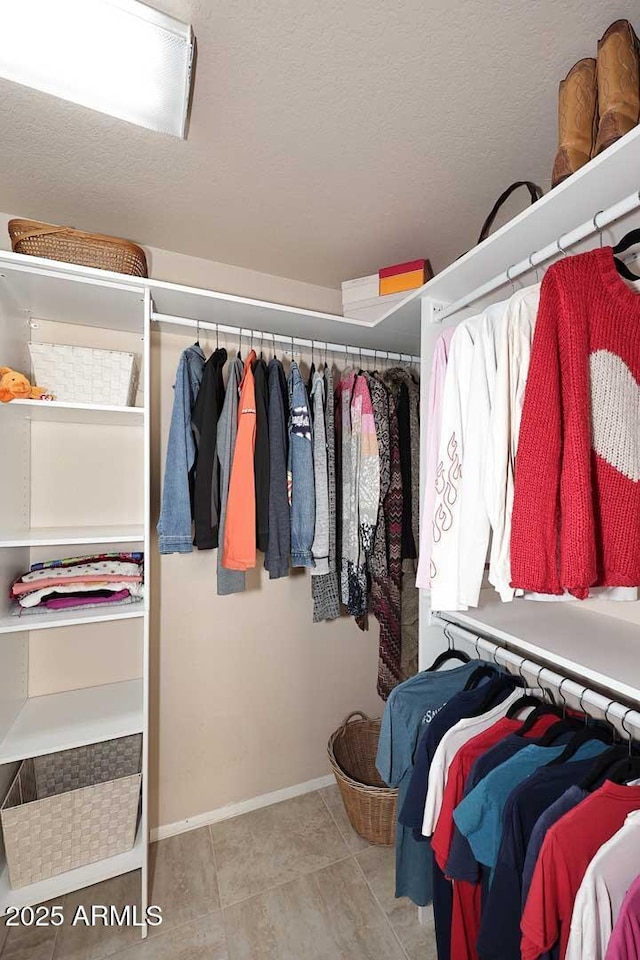 9115 N 101st Way, Scottsdale, AZ 85258 - walk in closet with tile patterned floors